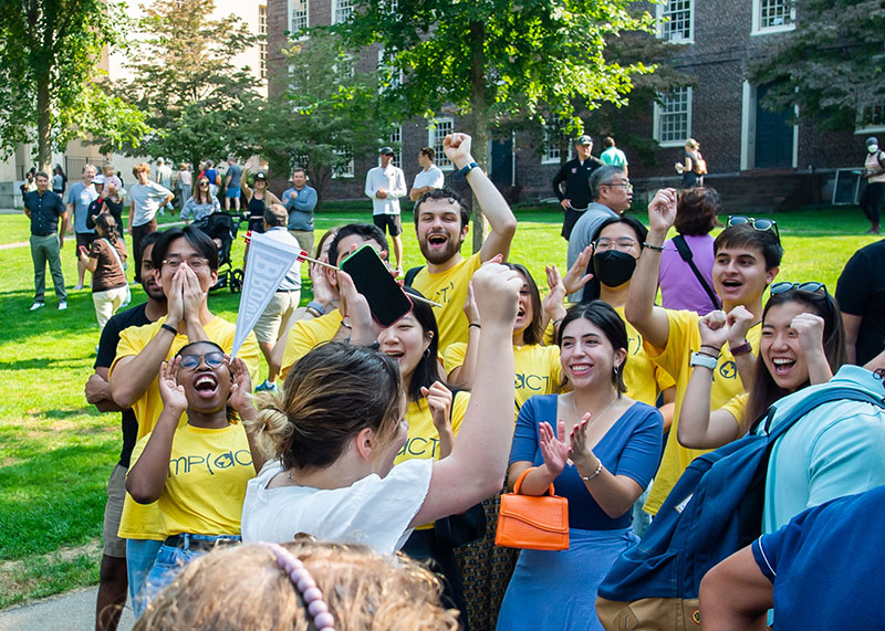 international students sheering for new incoming international students at Convocation