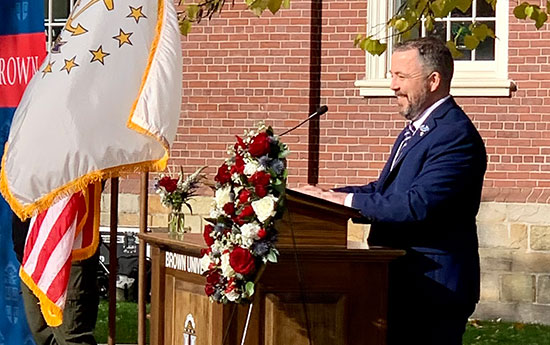 Brehan Brady ’23 introduces Sen. Jack Reed during the Veterans Day event.