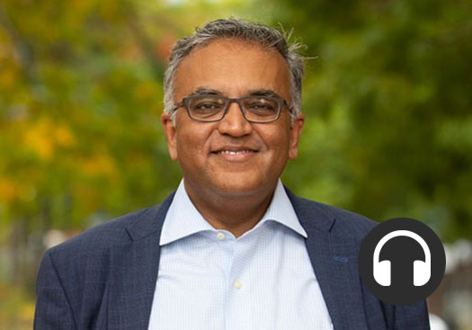 Dr. Jha, overlayed by a headphones icon