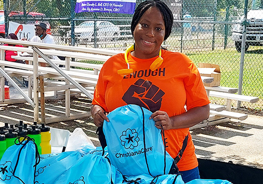 Dr. Lee packing bags for donations