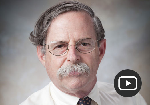 Arthur Horwich headshot with play button