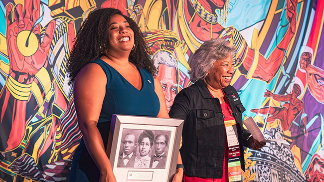 Stephanie Harris presents Judy Sanford Harris with IPC Black Legacy award at Black Alumni Reunion