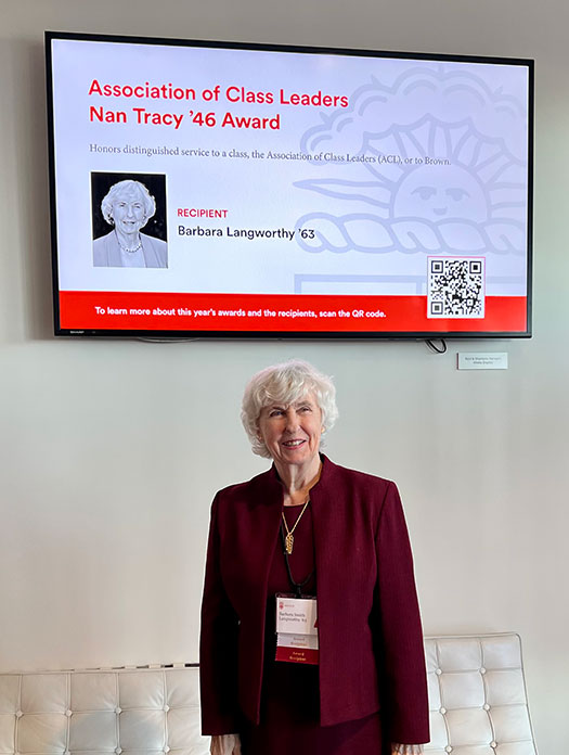 Barbara Langworthy below Nan Tracy '46 Award sign